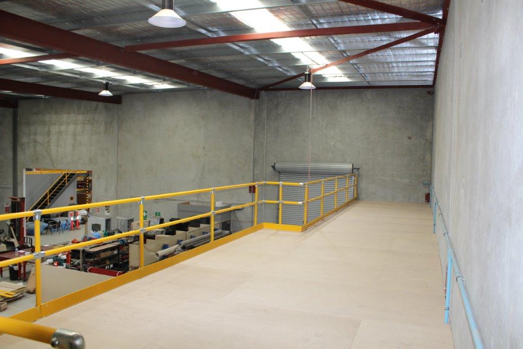 Mezzanine Floors with Yellow Handrail Pipe Clamps - DMD Storage Group
